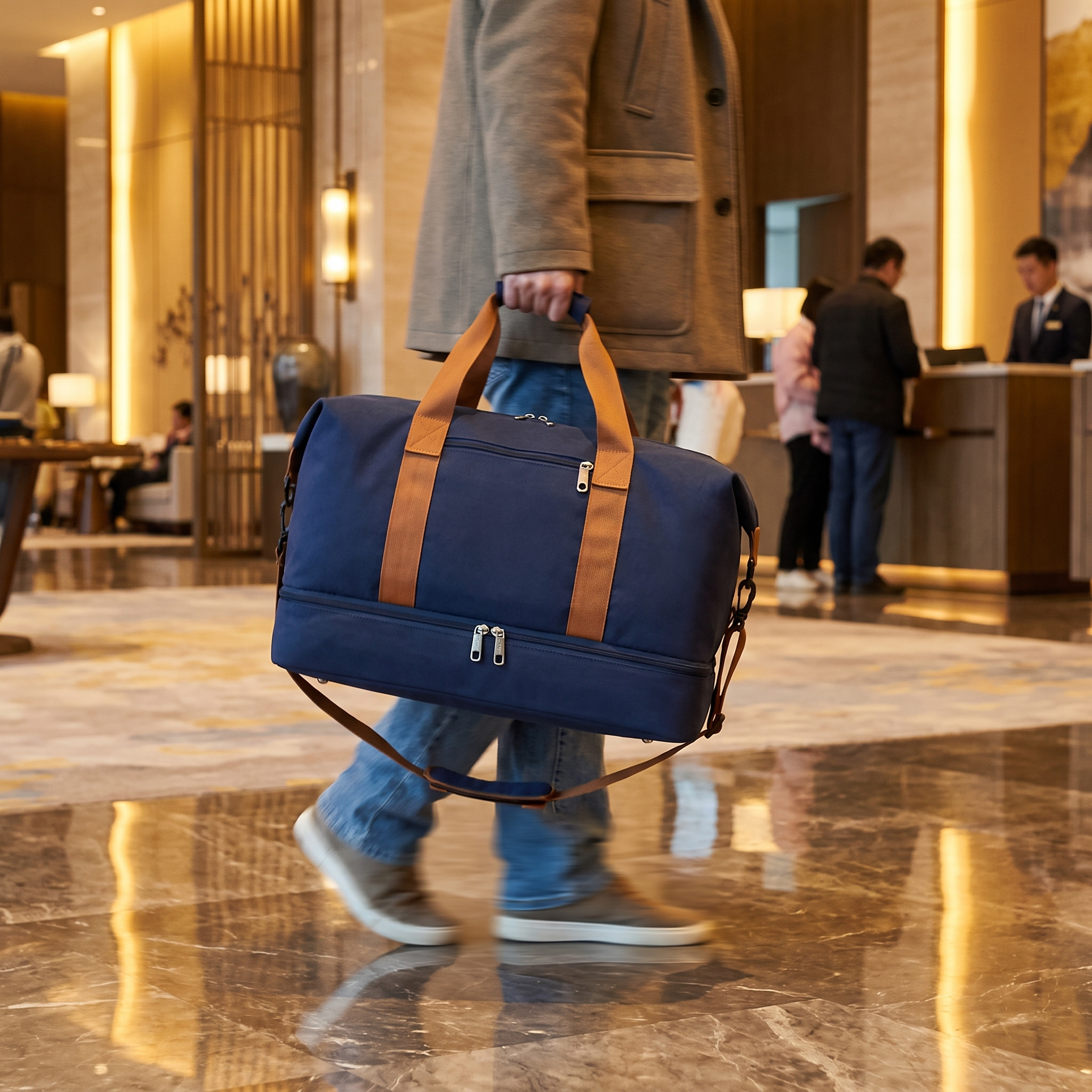 Weekender Duffle Bag (Blue) carried into a hotel lobby