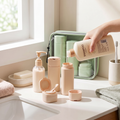 Beige 4-in-1 travel bottle set on bathroom counter