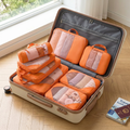 Orange 6-piece packing cube set in real-life use